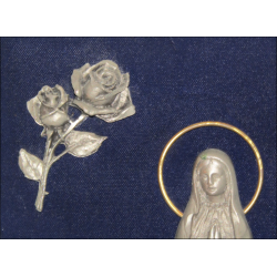 Representation of the Apparition of Lourdes in chased pewter on blue velvet